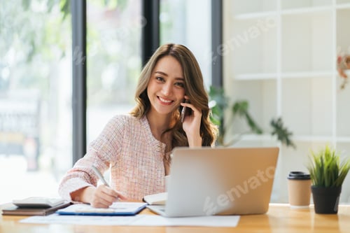 Preview: Asian business woman making a phone call and smiling indoor