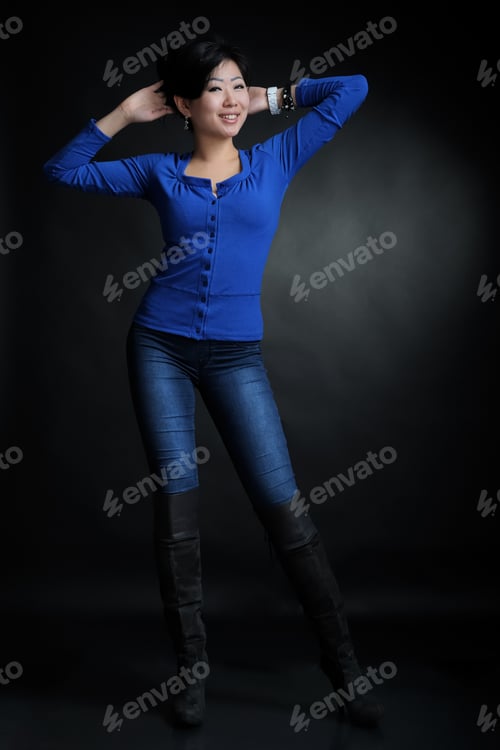 Preview: Asian Woman In Blue Shirt In Studio