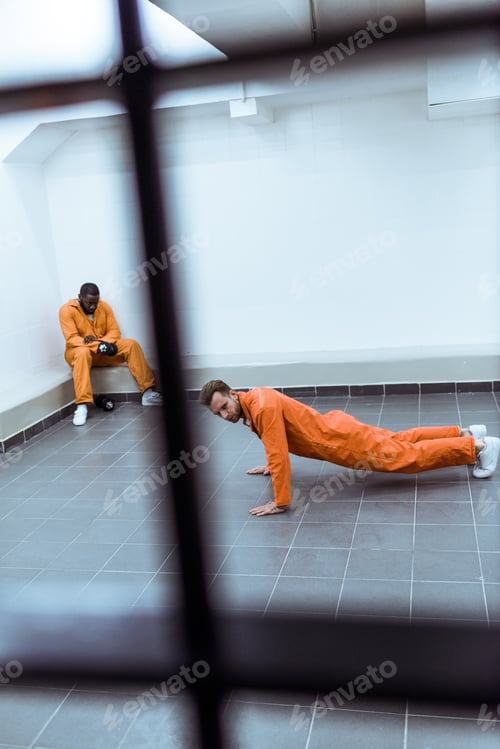 Preview: prisoner doing push-ups in prison cell
