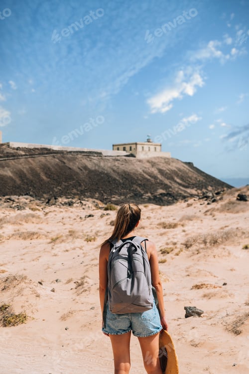 Vista previa: Woman walking on road in mountains