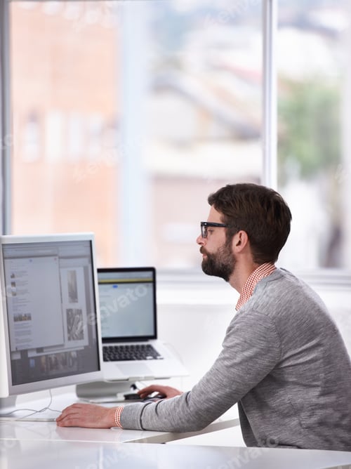 Preview: Browsing for inspiration. A young designer surfing the net for inspiration.