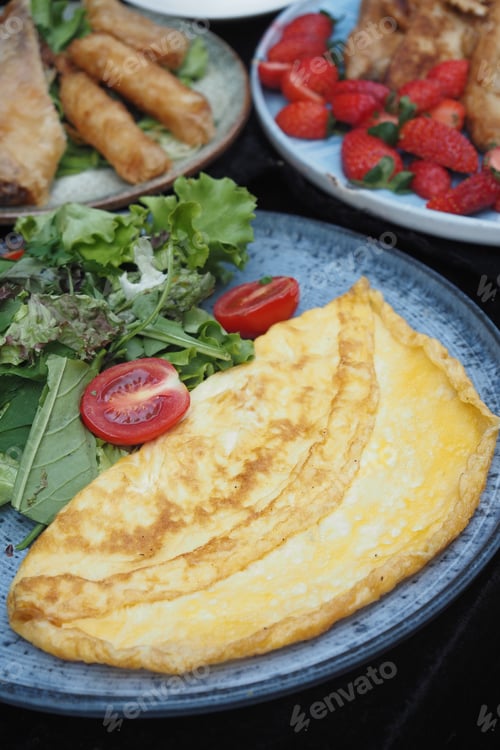 Preview: Plain Egg Omelette and fresh salad on. plate