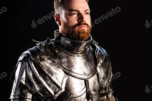 Preview: handsome knight in armor looking away isolated on black