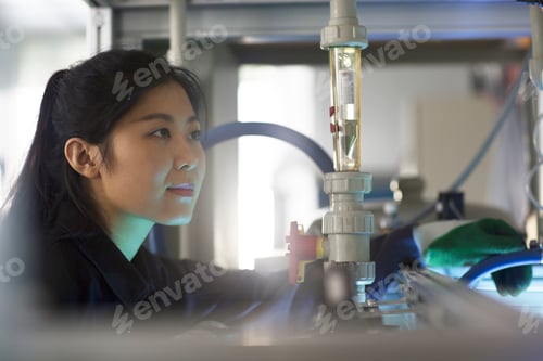 Preview: Technician operating machine in factory