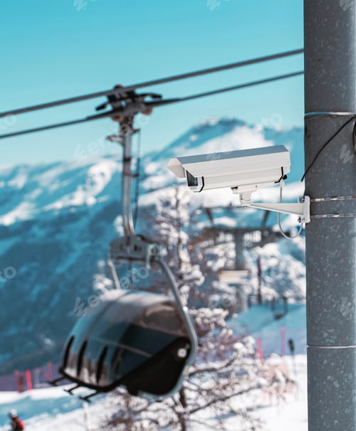 Preview: Surveillance camera monitoring ski slope with snowy mountains in background. In Folgarida