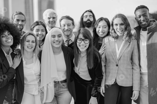 Preview: Group of multiracial business people smiling in front of camera outside of office in the city