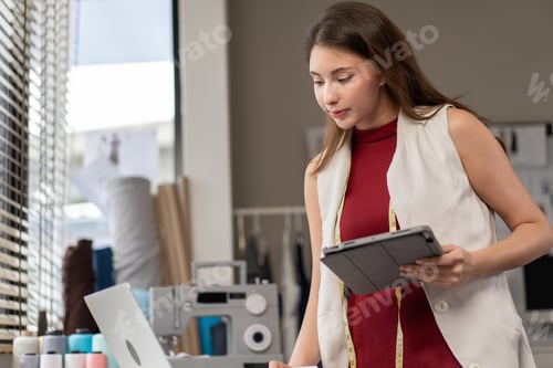 Preview: Creative Woman Designs with Laptop and Tablet