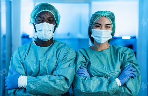 Preview: Multiracial doctors wearing personal protective equipment fighting against corona virus outbreak