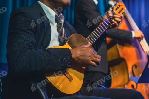 Preview: orchesta playing a "Cuatro", a typical Venezuelan musical instrument. Concept of music and typical i