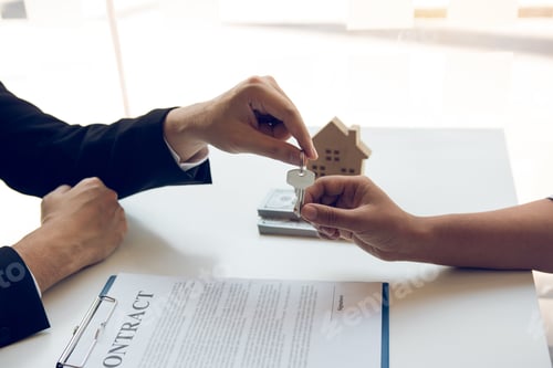 Preview: New home buyers are signing a home purchase contract at the agent's desk.