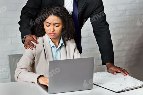 Preview: Sexual harassment in office. African American boss molesting his female employee at workplace
