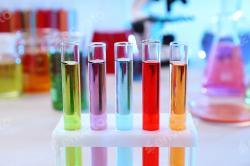 Preview: Test tubes with samples in rack on table. Solution chemistry