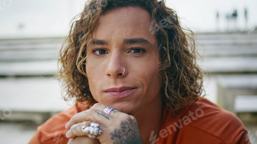 Preview: Portrait trendy guy hipster looking camera with smile outdoor. Man relaxing