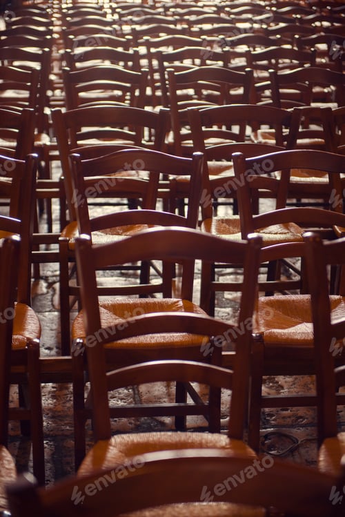 Preview: Rows of traditional wooden chairs