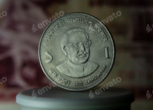 Preview: Close-up of a Bangladesh one taka coin against a dark background