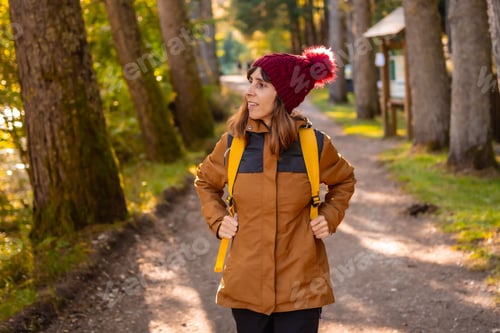 Preview: Irati jungle in autumn, lifestyle, a young woman on the forest path at sunset