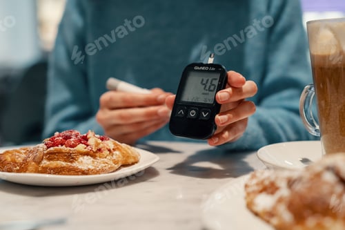 Preview: Diabetic woman measuring normal sugar level. Preparing yourself for meals