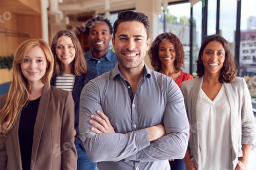 Preview: Portrait Of Multi-Cultural Business Team Standing In Modern Open Plan Office Together