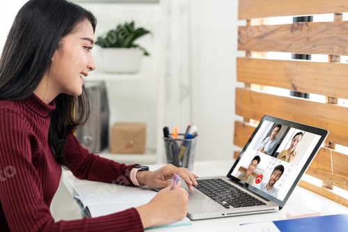 Preview: Asian business woman talking to colleague team about plan in video conference at home.