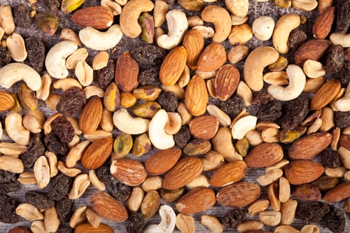 Preview: Close up of Mix of healthy raw nuts on wooden background