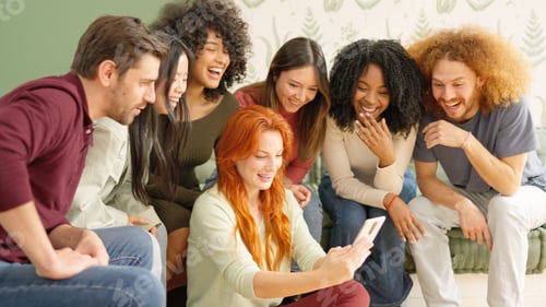 Preview: Friends looking at a mobile and laughing at one video