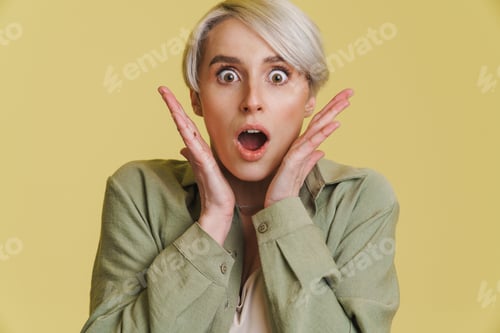 Preview: Young white-haired woman expressing surprise at camera
