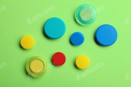 Preview: Bright magnets on color background, top view