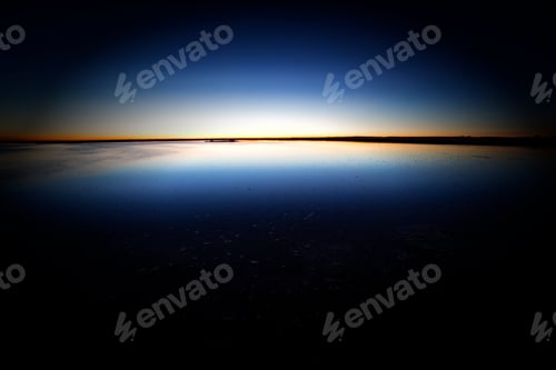 Preview: Tranquil blue water surface in dark sunset
