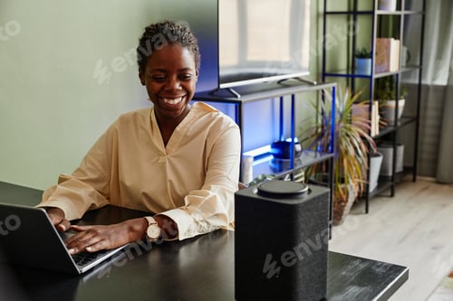 Preview: Smiling Woman using Smart Speaker