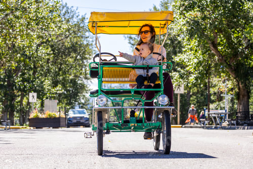 Preview: Mother and Child Enjoy a Bicycle Ride in Waterton, Alberta on a Sunny Day