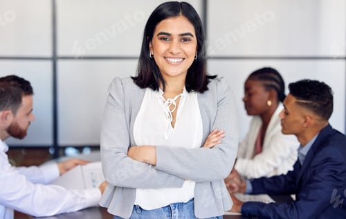Preview: Unafraid and goal bound. Shot of a young businesswoman in the middle of a meeting.