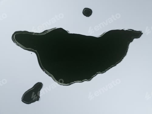 Preview: Aerial view of a freezing lake covered with snow.