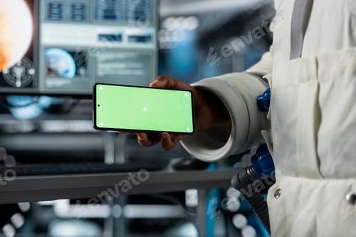 Preview: Close up of scientists using mockup mobile phone in futuristic starship