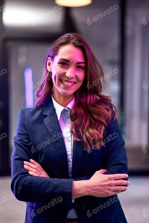 Preview: Smiling Woman in Business Attire Posing Indoors