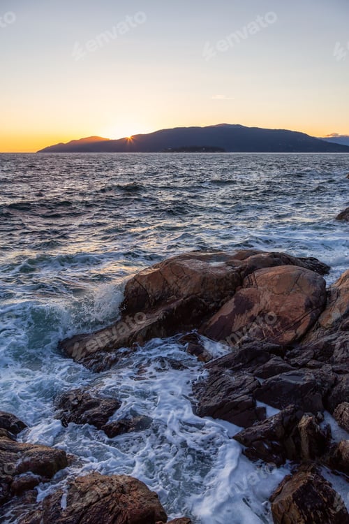 Preview: Rocky ocean coast during a vibrant sunny sunset