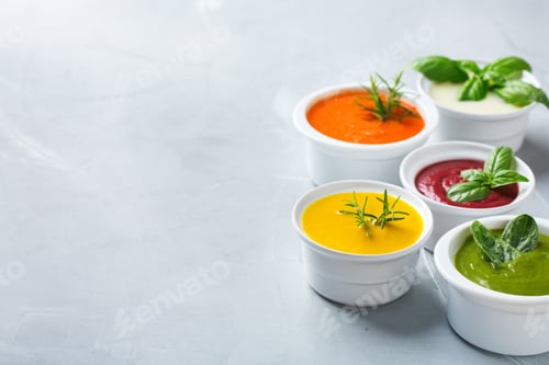 Preview: Set of seasonal fall autumn creamy soups on a table