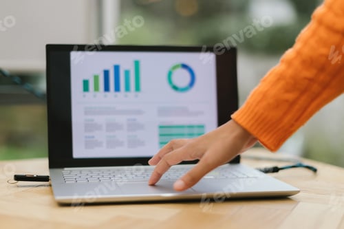 Preview: detail on hand on laptop touch pad changing slides at a conference