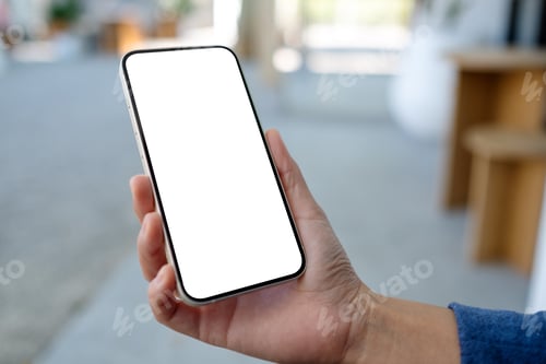 Preview: Mockup image of a woman holding and using mobile phone in the outdoors