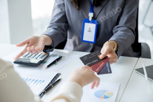 Preview: Employees present with mock up credit card payments to business customers. Ready provide discounts