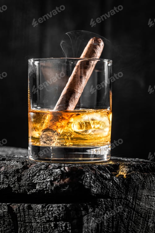 Preview: Cigar put out in a glass of whiskey