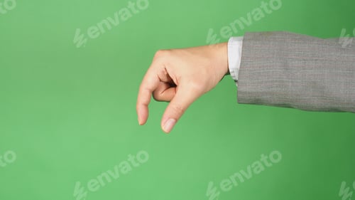 Preview: A pinching or picking gesture hand on green background.
