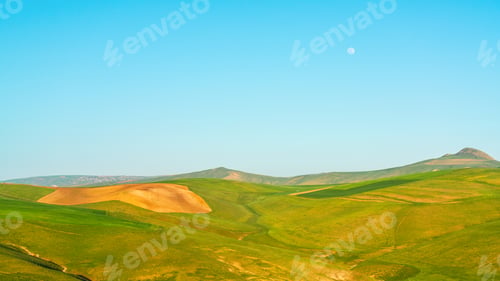 Preview: Green hills and blue sky landscape