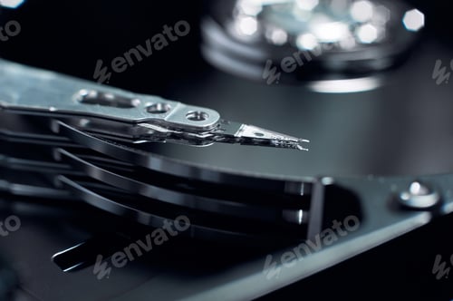 Preview: Disassembled hard disk. Read head, magnetic disk and spindle close-up.