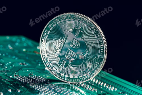 Preview: golden bitcoin and computer chip in background