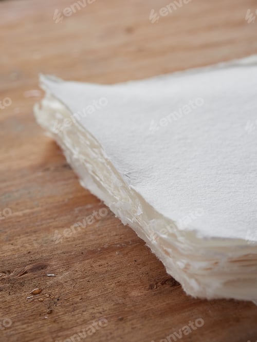 Preview: Stack of handmade paper sheets. Old traditional process of paper production