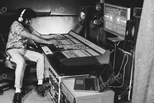 Preview: African music producer mixing new music album inside boutique studio - Focus on right hand
