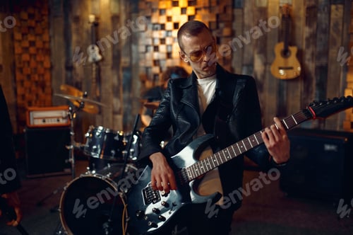 Preview: Brutal guitarist with electric guitar on stage