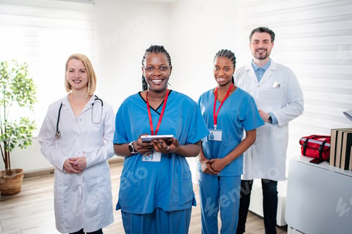Preview: Diverse healthcare team smiling in modern clinic