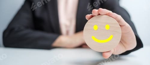 Preview: hand holding smile face block. Customer choose Emoticon for user reviews. Service rating