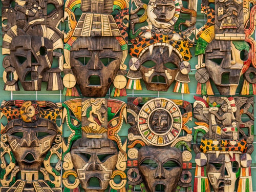 Preview: Closeup shot of a piece of artwork featuring wooden faces put on top of each other
